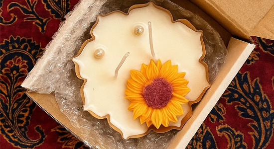 Handmade Sunflower Urli Candle from Candlesence Online, beautifully packaged in its gift box.